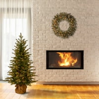 Tvrtka A. M. prethodno je zapalila umjetno mini božićno drvce A. M., zeleno, skandinavska smreka, bijeli vijenci,